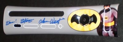 This is a custom printed faceplate featuring Adam West, who starred in the late 60's TV show. It is autographed by Mr. West.