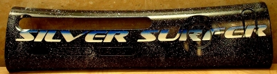 Not the actual Silver Surfer logo, but made from a generic font. Plate included a Silver Surfer figure.