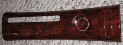 Budget retail plate that looks like red wood. Maker is unknown.