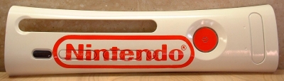 Simple white plate with the classic red Nintendo logo.